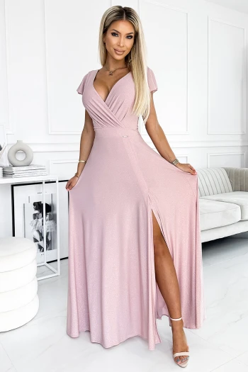 The woman in the photo is wearing a stunning floral maxi dress, showcasing its elegant design and vibrant colors. This maxi dress features a flattering wrap style, perfect for any occasion.