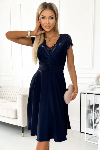 The woman in the photo is wearing a vibrant pink off-shoulder dress, highlighting the elegant design of the dress. The model showcases the dress's flattering fit and stylish ruffle detail, perfect for any special occasion.