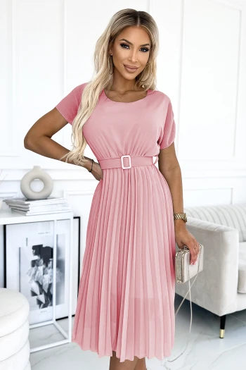 The woman in the photo is wearing a stunning floral wrap dress, showcasing its elegant design and vibrant pink hues. This floral wrap dress perfectly complements her style, making it ideal for both casual and formal occasions.