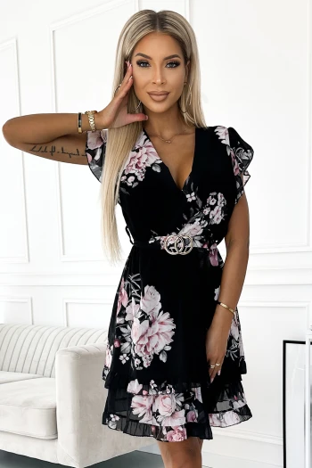 The woman in the photo is wearing a stylish emerald green dress with a flattering wrap design. This elegant green dress is paired with a chic nude clutch, perfect for any sophisticated occasion.