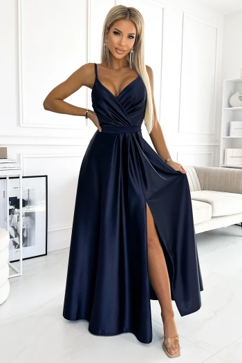 The woman in the photo is wearing a stunning blue lace evening gown, showcasing its elegant design and intricate detailing. This blue evening dress is perfect for formal occasions, offering a blend of sophistication and style.