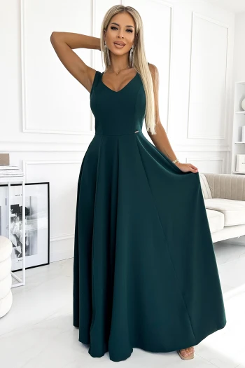 The woman in the photo is wearing a chic floral dress, showcasing its elegant design and vibrant colors. This stylish floral outfit is perfect for any occasion, highlighting both comfort and fashion.