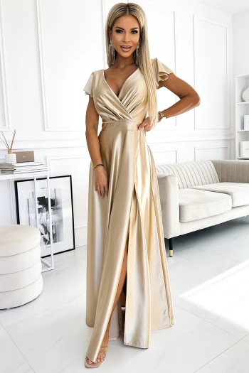 The woman in the photo is wearing a stunning burgundy evening gown, featuring a deep V-neckline and elegant cap sleeves. This glamorous dress showcases a flowing skirt with a high slit, perfect for making a statement at any formal event.