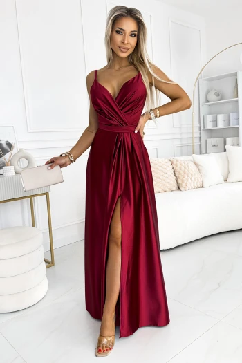 The woman in the photo is wearing a stylish, patterned dress that highlights the vibrant colors and intricate design. This chic dress is perfect for making a statement at any event.