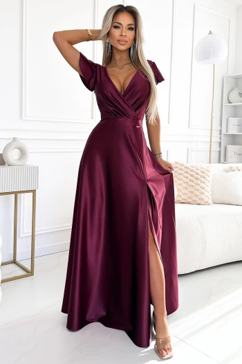The woman in the photo is wearing a chic olive green dress, perfectly highlighting the elegant design of the Olive Green Midi Dress. The model showcases the dress's flattering fit and sophisticated style, ideal for any occasion.