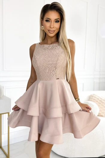 The woman in the photo is wearing a stunning magenta evening gown, featuring a wrap-style bodice and a high slit for added elegance. This elegant dress perfectly complements her sophisticated look, ideal for formal occasions.