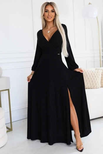 The woman in the photo is wearing a sleek black cocktail dress, highlighting its elegant silhouette and timeless appeal. The model showcases the dress's sophisticated design, perfect for any formal occasion.