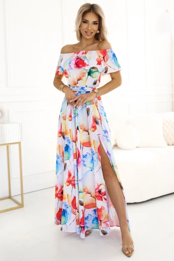 The woman in the photo is wearing a stylish beige button-up shirt dress, perfect for casual and elegant occasions. The model showcases the shirt dress with rolled-up sleeves and a tied waist, highlighting its versatile design.