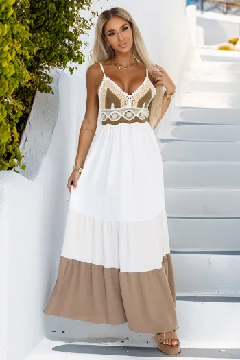 The woman in the photo is wearing a stylish green sleeveless dress, featuring a pleated hem that adds a touch of elegance. This chic dress is perfect for both casual outings and formal events, showcasing its versatility.