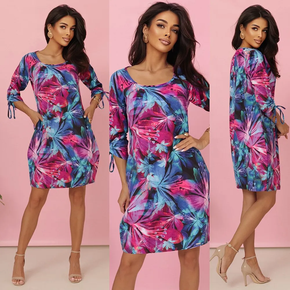 The woman in the photo is wearing a chic off-the-shoulder brown maxi dress, elegantly cinched with a woven belt. This stylish maxi dress is perfect for both casual outings and sophisticated events.