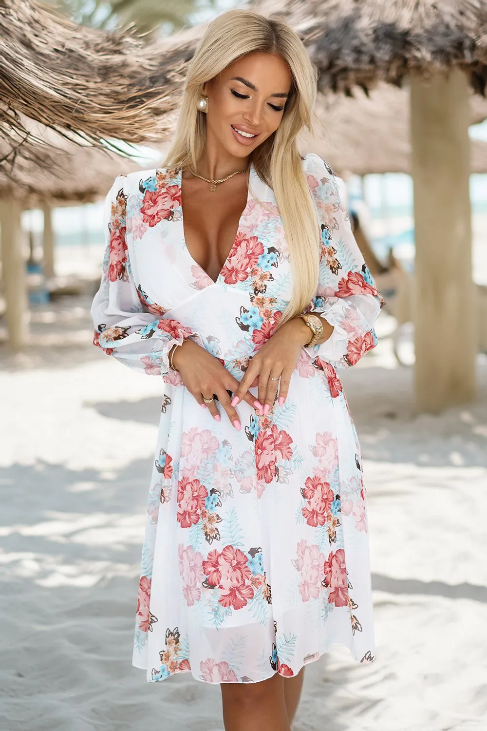 The woman in the photo is wearing a stylish mint green lounge set, featuring a long-sleeve top and a matching skirt. This elegant lounge set offers both comfort and sophistication, perfect for a relaxed yet chic look.