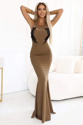 The woman in the photo is wearing a stylish navy blue shirt dress, highlighting its elegant design and flattering fit. This shirt dress features a belted waist, adding a touch of sophistication to the overall look.