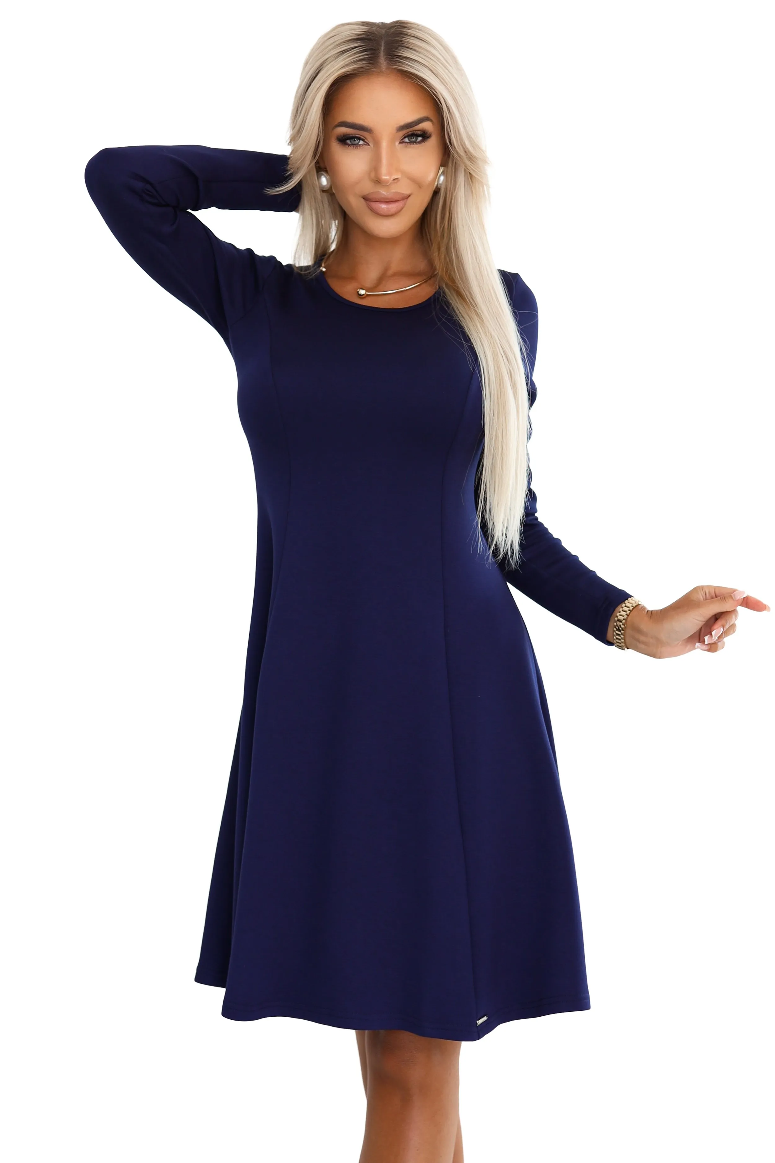 The woman in the photo is wearing a stunning floral maxi dress, perfect for elegant occasions. The model showcases the dress's vibrant pattern and flowing design, highlighting its chic and sophisticated style.