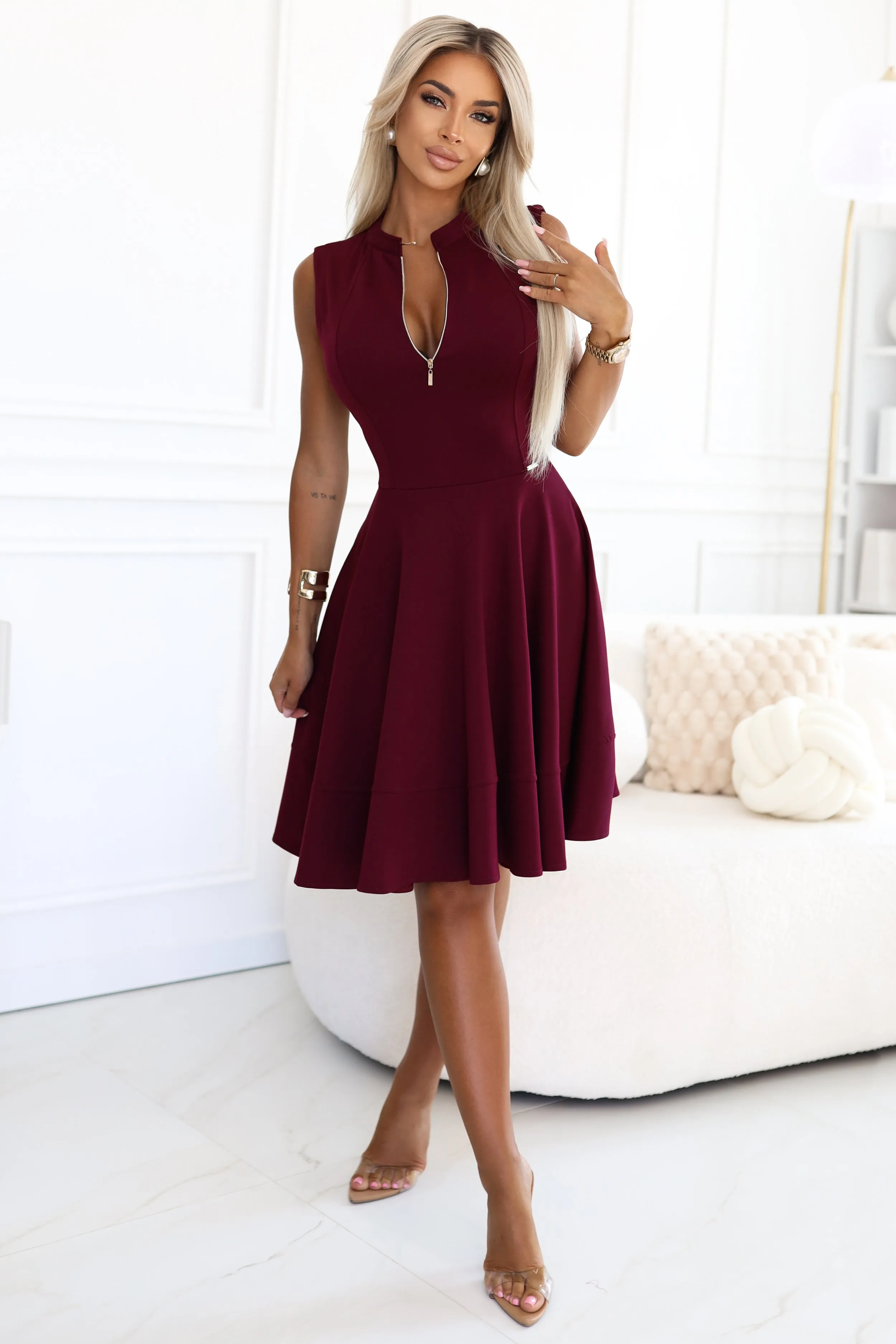 The woman in the photo is wearing a chic, oversized cardigan, perfect for layering in cooler weather. This stylish cardigan adds a cozy yet fashionable touch to any outfit.
