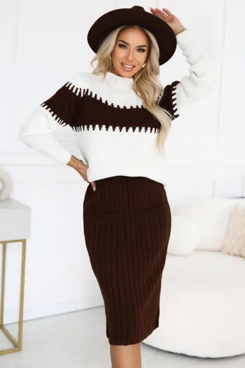 The woman in the photo is wearing a stylish sweater and skirt set, featuring a brown and white color-blocked sweater with a high neckline. The matching ribbed brown skirt complements the ensemble, creating a chic and cohesive look.