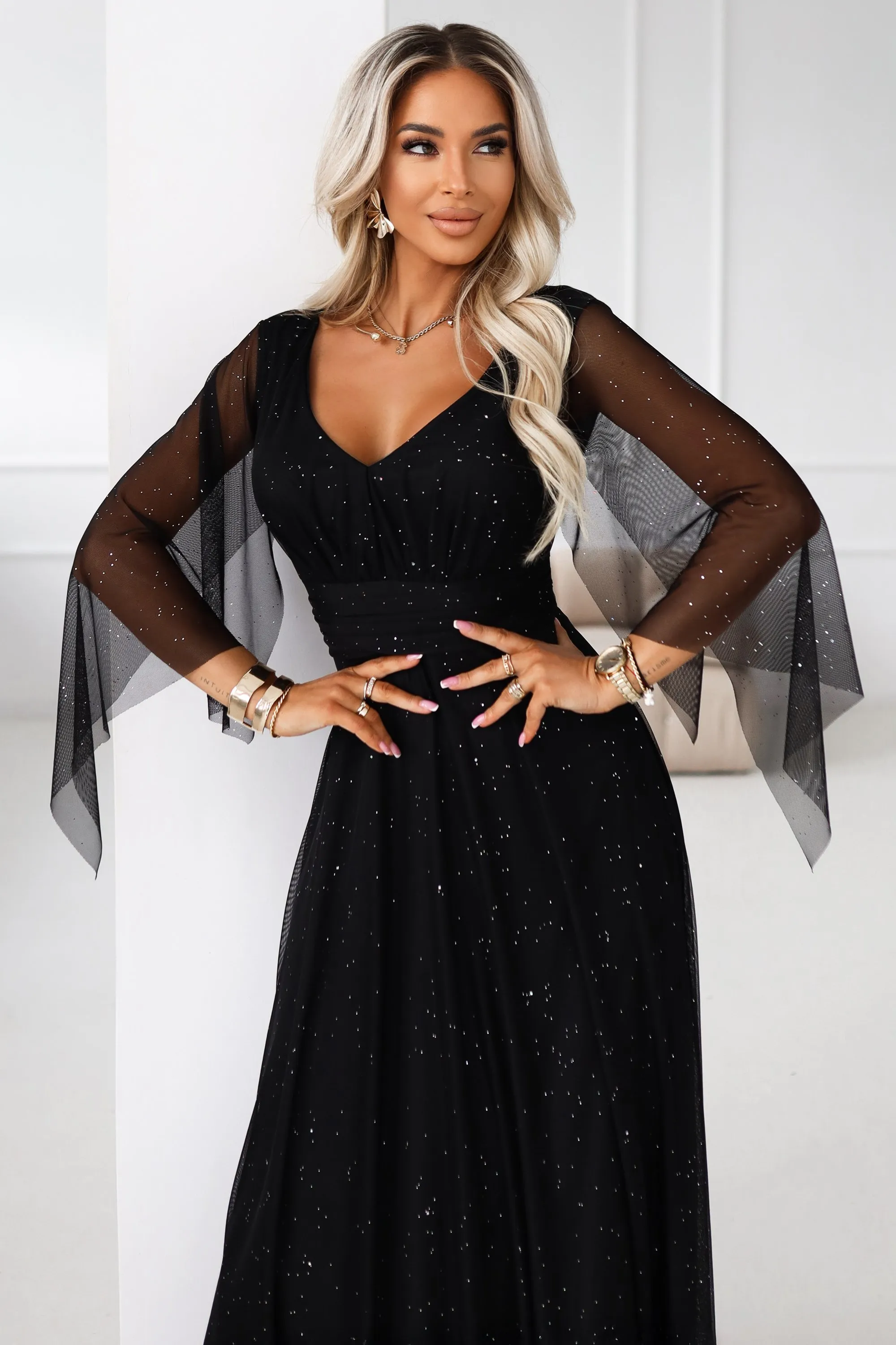 655-1 Long, shimmering dress with a neckline and transparent sleeves - black