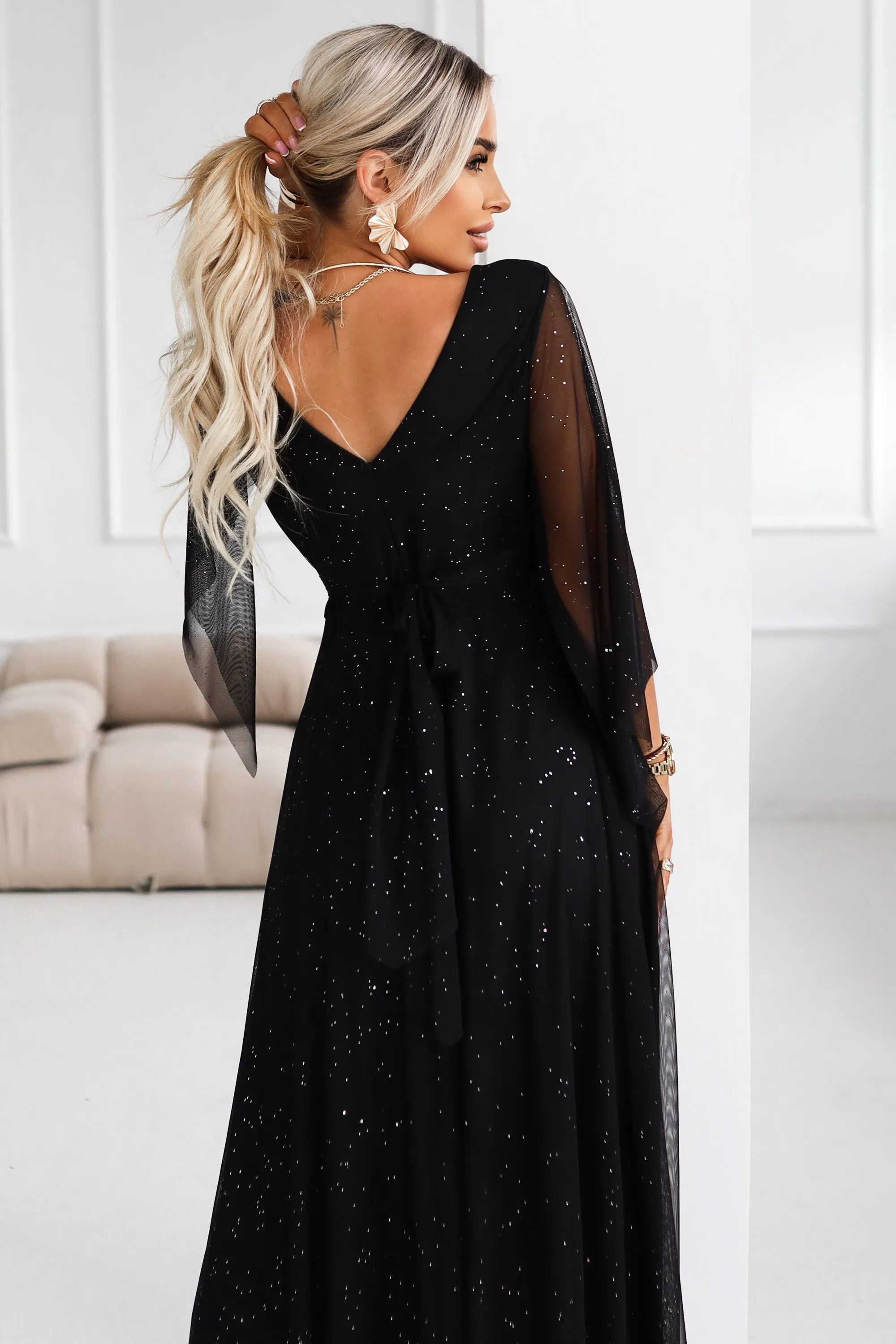 655-1 Long, shimmering dress with a neckline and transparent sleeves - black
